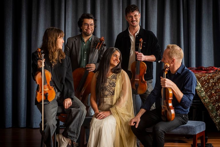 Australian String Quartet musicians holding violins and cello with singer Parvyn Kaur Singh in traditional dress, photo by Samuel Jozeps.